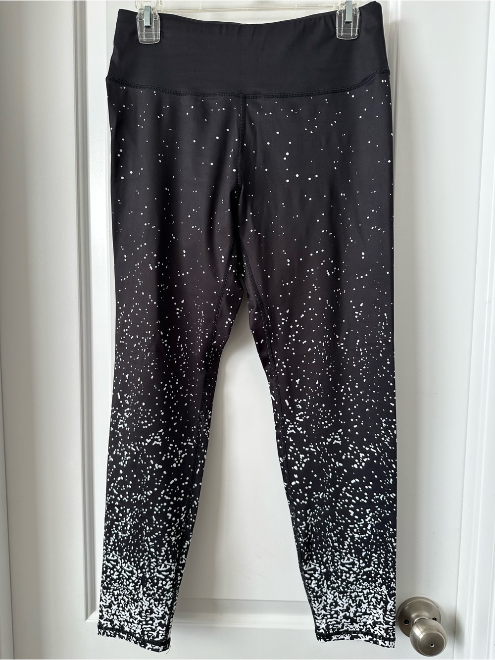 2 Pair of Woman’s black Speckled and Black Stars Active Leggings